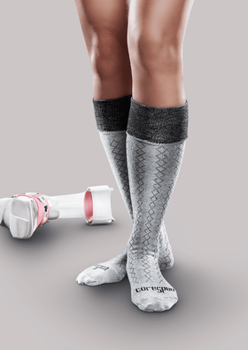Woman with AFO brace wearing Core-Spun Classic Diamond Patterned AFO Socks by SmartKnit for Adults