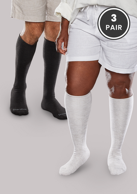Woman and man wearing White SmartKnit Seamless Diabetic Over-the-Calf Socks - 3 Pair